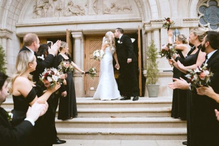 Bride and groom on church steps